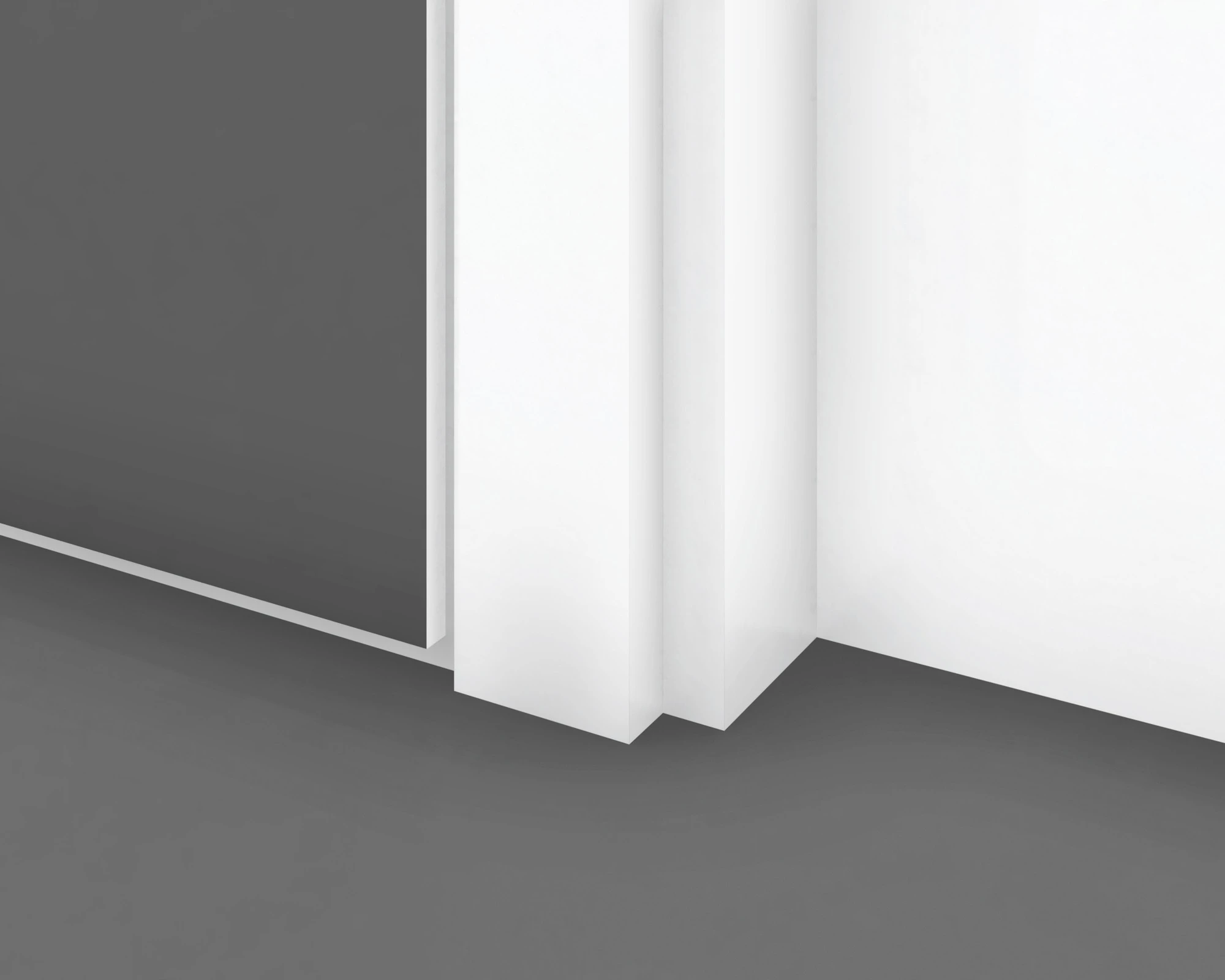Close-up of a door jamb meeting the floor beside a narrow reveal at the base of the wall.